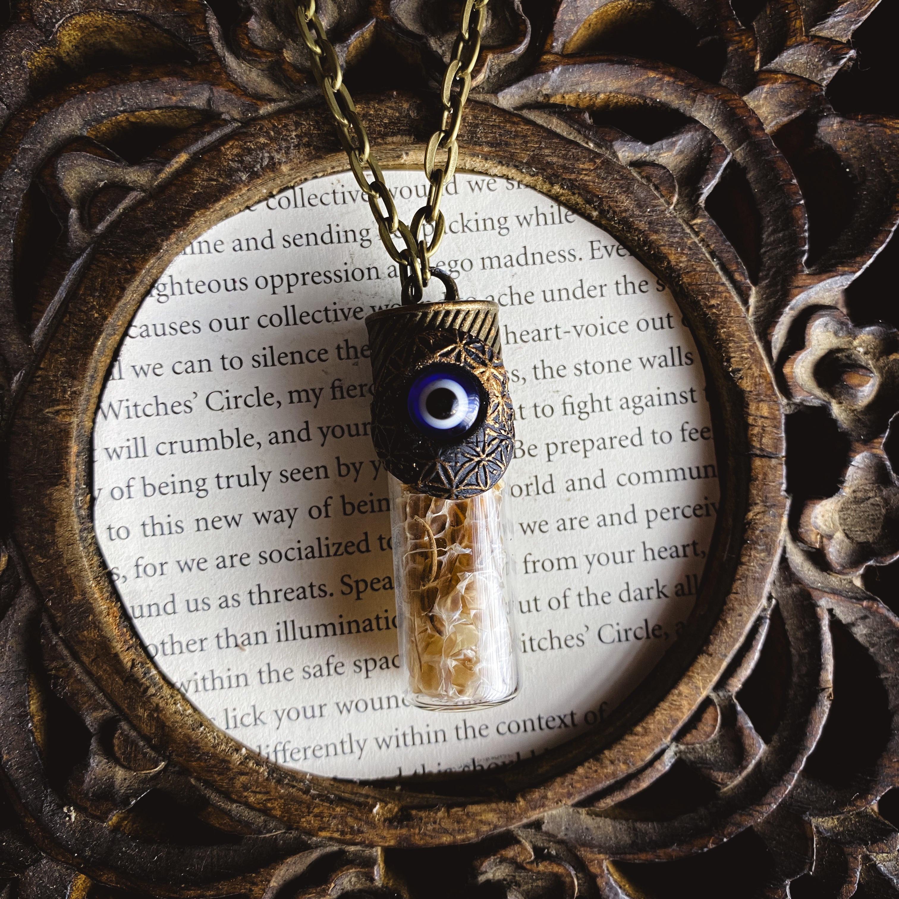 Conjure Necklace with Snake Skin, Butcher's Broom, an Evil Eye and a Clay Flower of Life Pattern