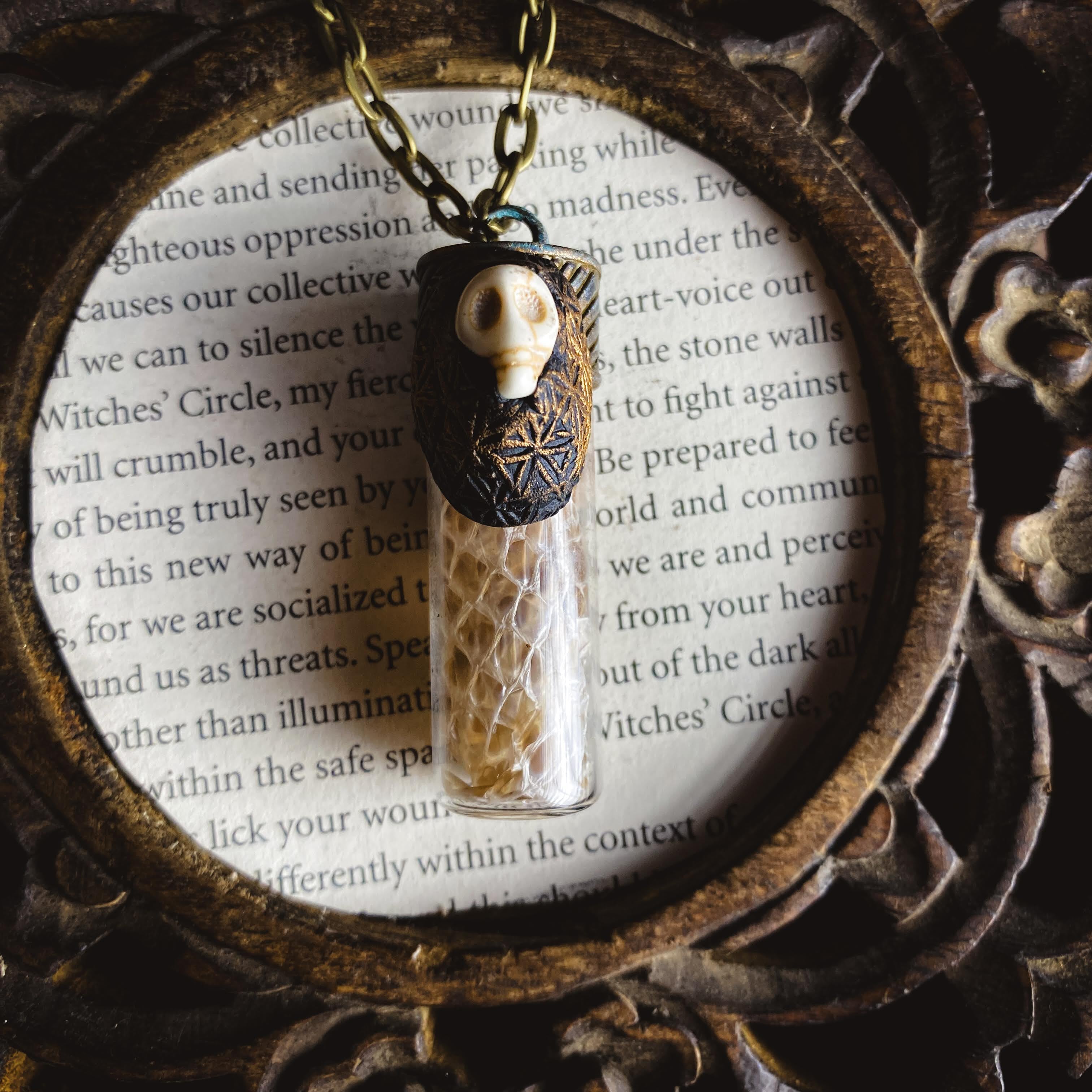 Conjure Necklace with Snake Skin, Orris Root, a Howlite Skull and the Flower of Life Pattern