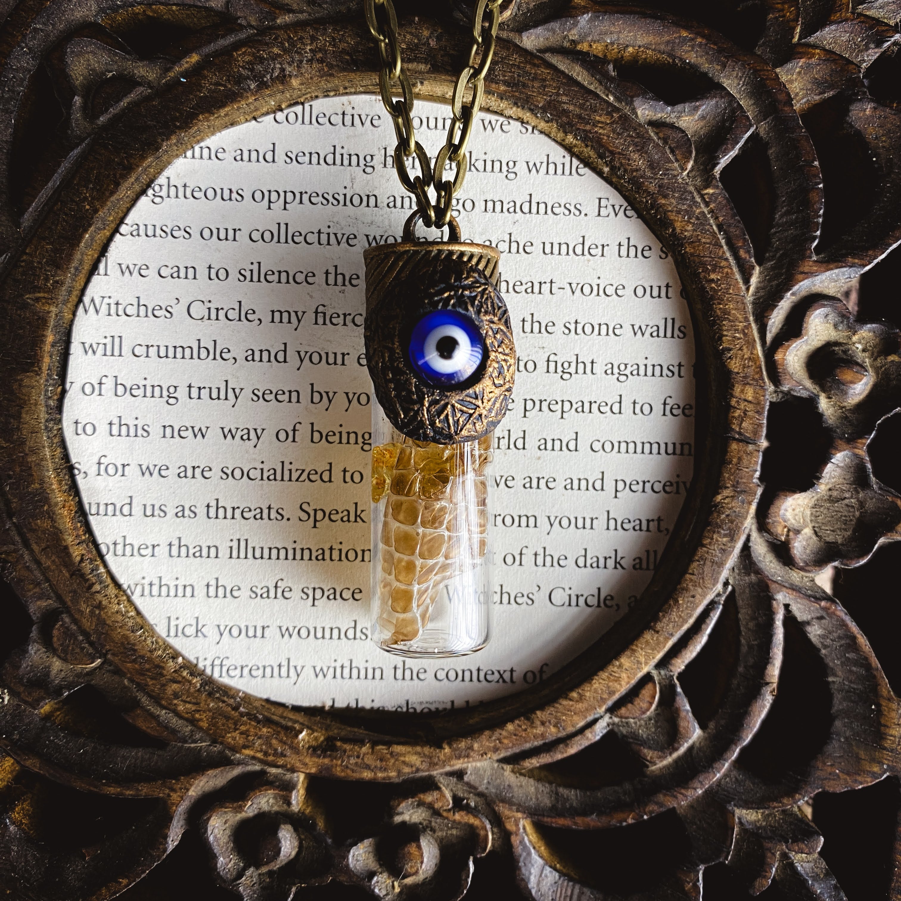 Conjure Necklace with Snake Skin, Copal, an Evil Eye and an Organic Clay Pattern